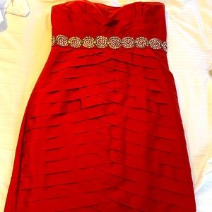 Gem-belted tulip bodycon strapless dress